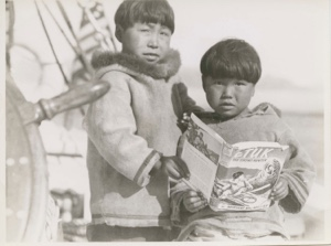 Image of Boys looking at Etuk- The Eskimo [Inuk] Hunter by Miriam MacMillan